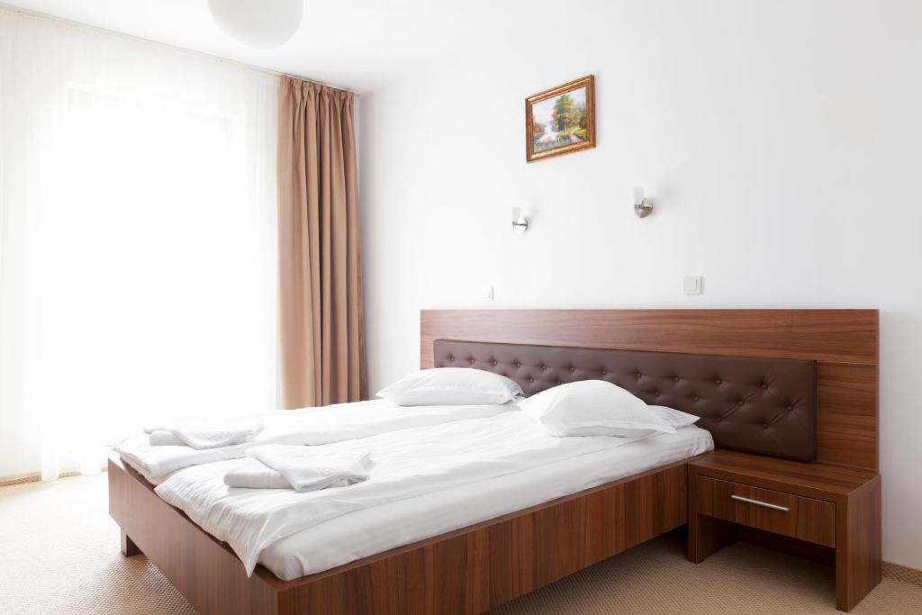 Postel nebo postele na pokoji v ubytování Hotel Mariss