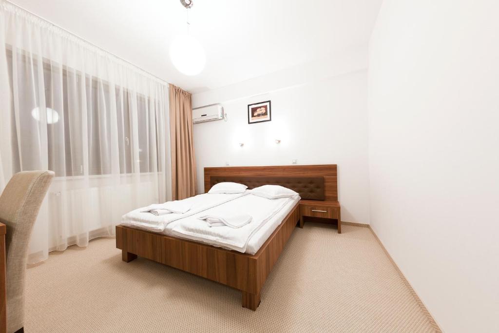 Postel nebo postele na pokoji v ubytování Hotel Mariss
