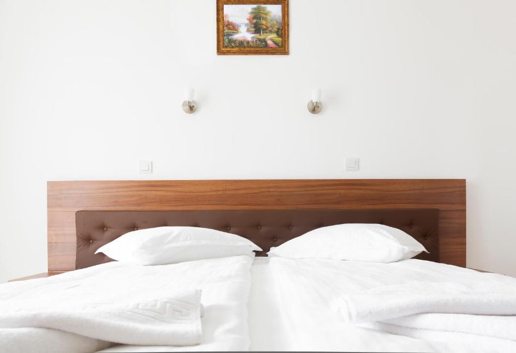 Postel nebo postele na pokoji v ubytování Hotel Mariss