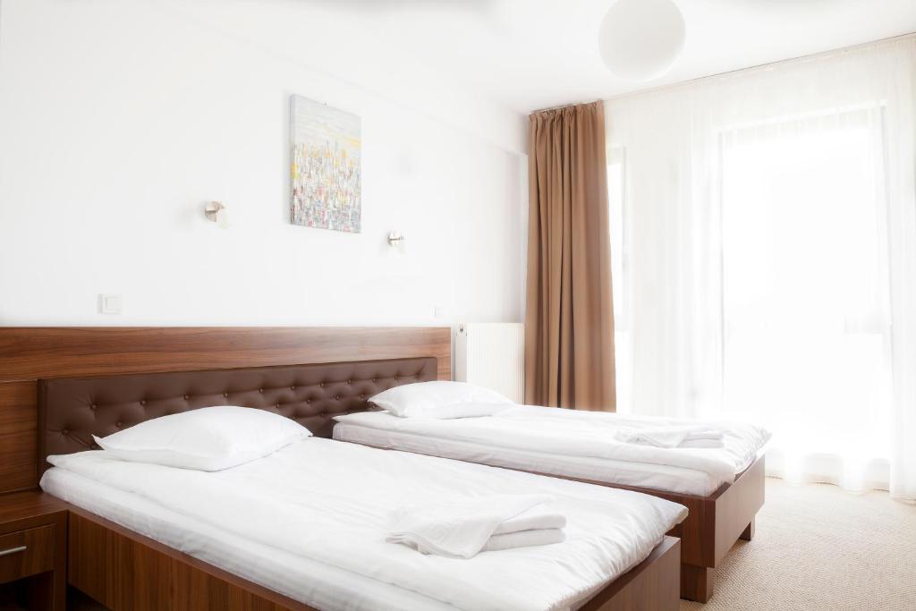 Postel nebo postele na pokoji v ubytování Hotel Mariss