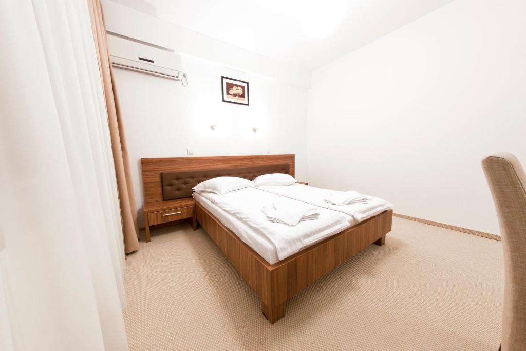Postel nebo postele na pokoji v ubytování Hotel Mariss