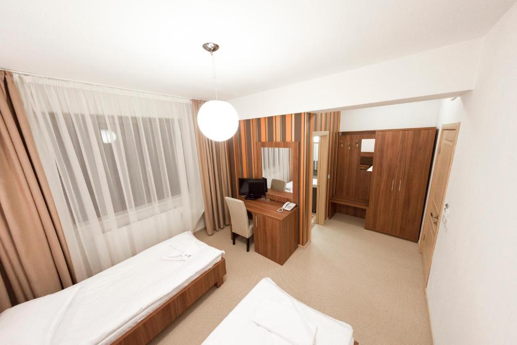 Postel nebo postele na pokoji v ubytování Hotel Mariss