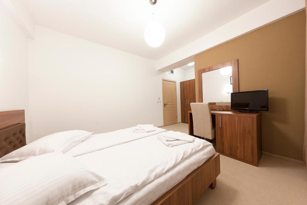 Postel nebo postele na pokoji v ubytování Hotel Mariss