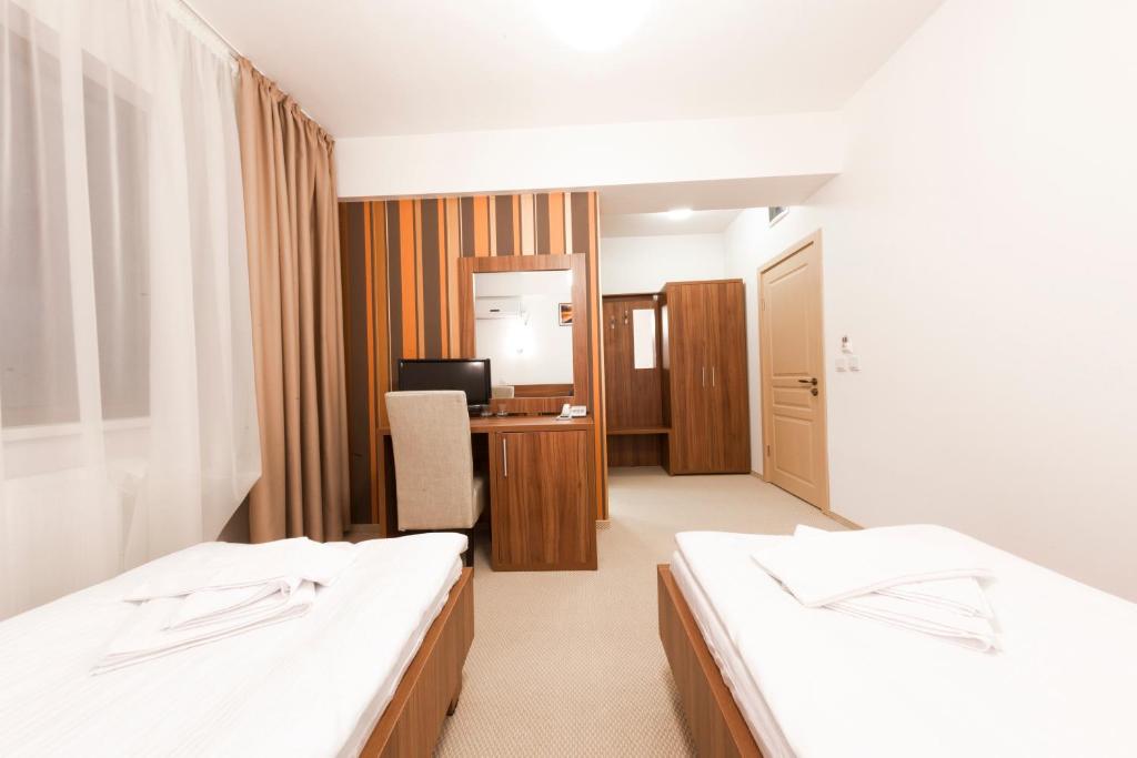 Postel nebo postele na pokoji v ubytování Hotel Mariss