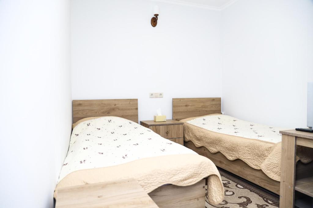 Postel nebo postele na pokoji v ubytování Hayi Tun Guest House