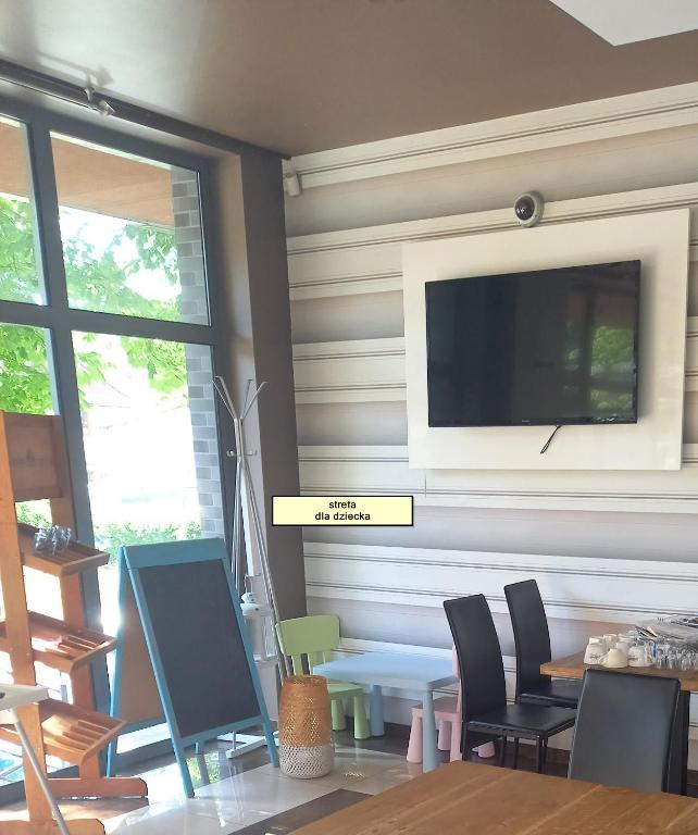 Telewizja i/lub zestaw kina domowego w obiekcie Planeta Apartment Mielno