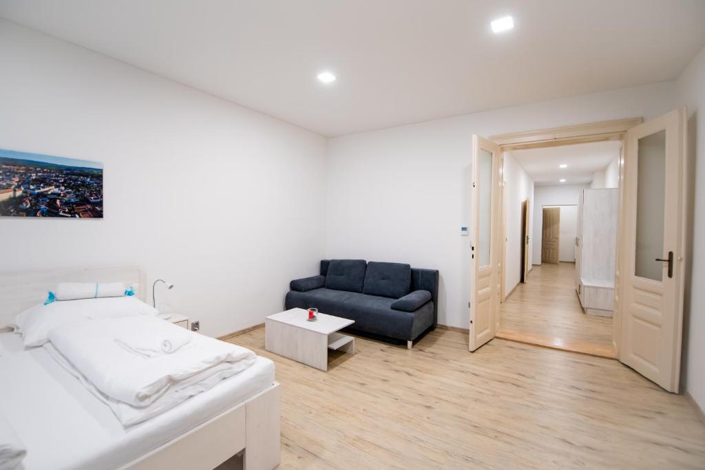 Postel nebo postele na pokoji v ubytování Apartmány Velké náměstí