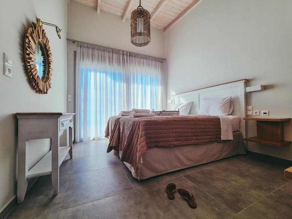 Postel nebo postele na pokoji v ubytování Owl Villas