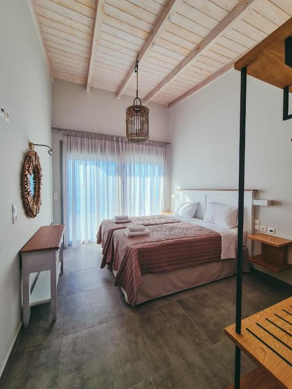 Postel nebo postele na pokoji v ubytování Owl Villas