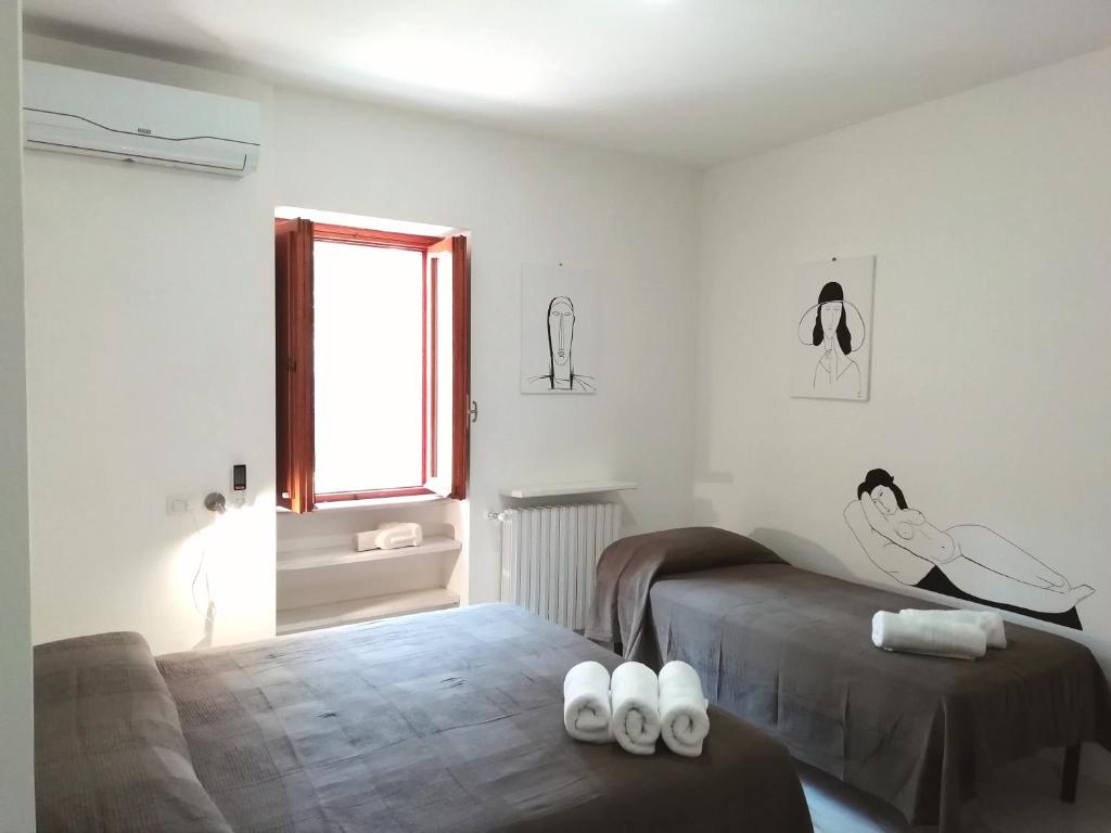 Postel nebo postele na pokoji v ubytování B&B L'Altare Bianco