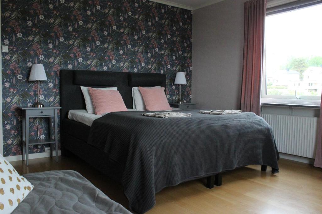 Кровать или кровати в номере Skulebergets Frestelse