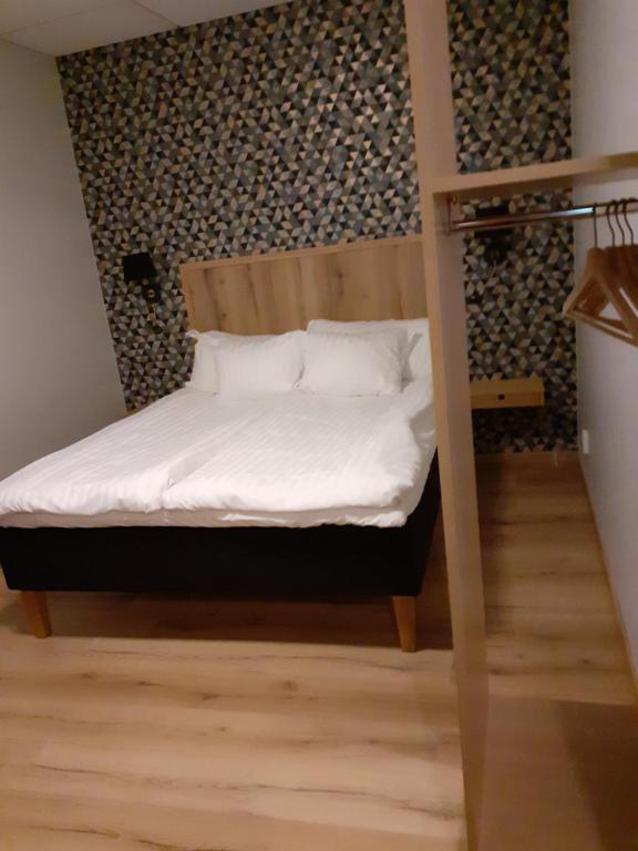 Postel nebo postele na pokoji v ubytování Hotell Greven