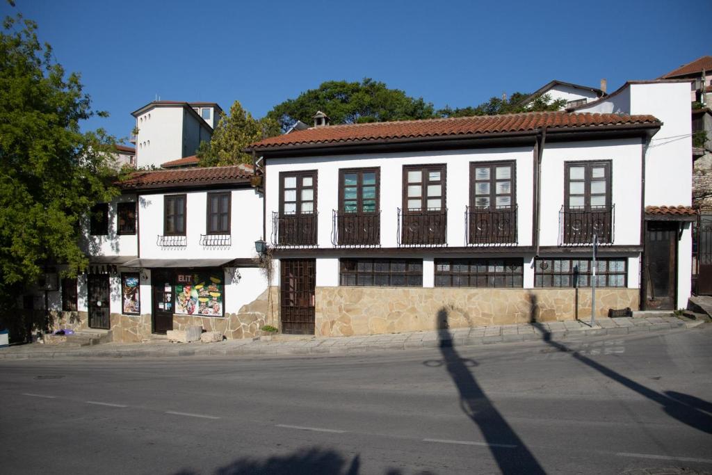 a building on the side of a street at Старата баkалия The old grocery, guest rooms in Balchik