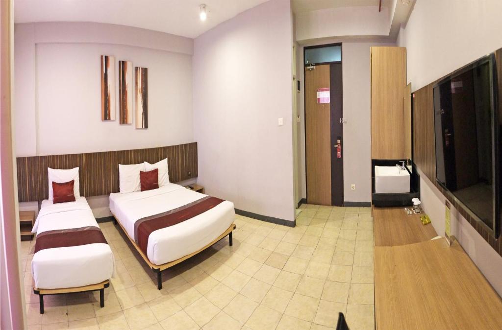 Postel nebo postele na pokoji v ubytování Valore Hotel