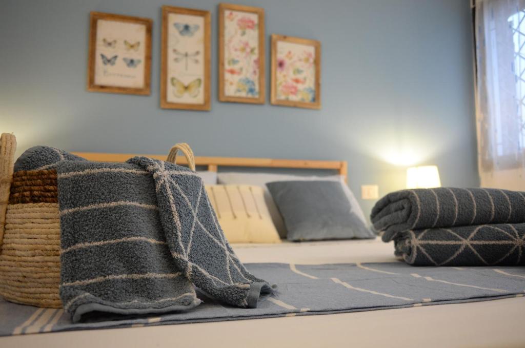 Łóżko lub łóżka w pokoju w obiekcie Villa Sangemi