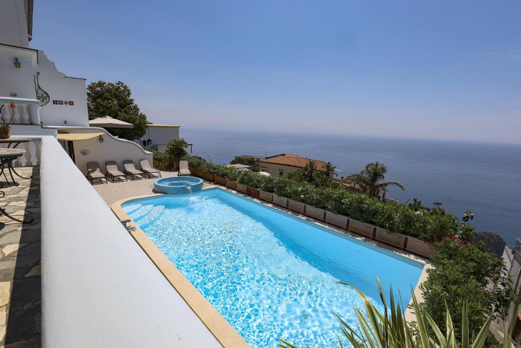 a swimming pool with a view of the ocean at Villa Elena in Conca dei Marini