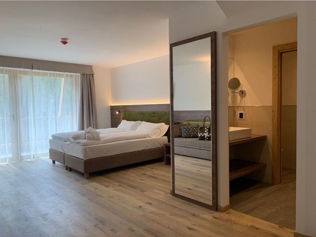Postel nebo postele na pokoji v ubytování Hotel Miravalle