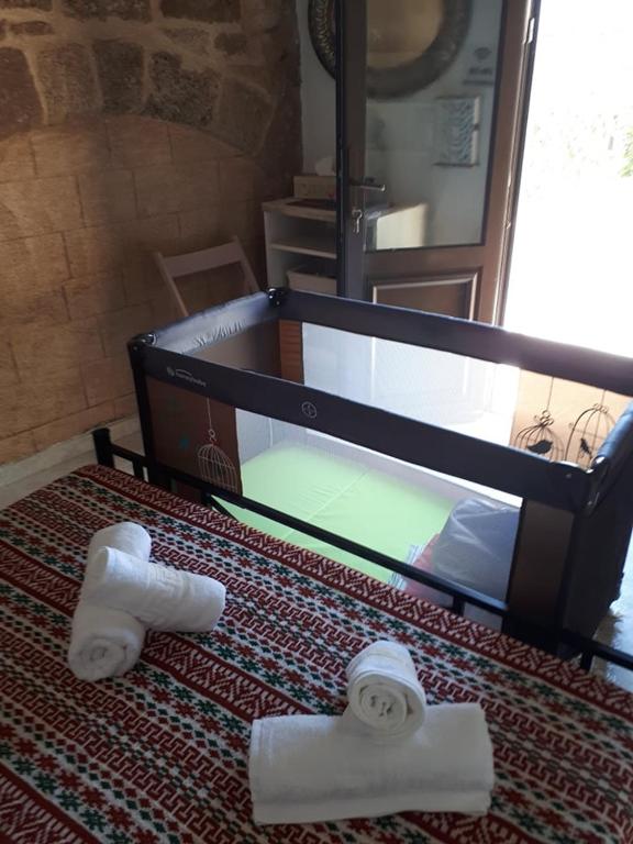 A bed or beds in a room at Traditional Stone house