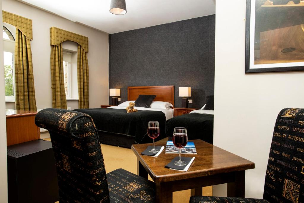Postel nebo postele na pokoji v ubytování Donegal Manor
