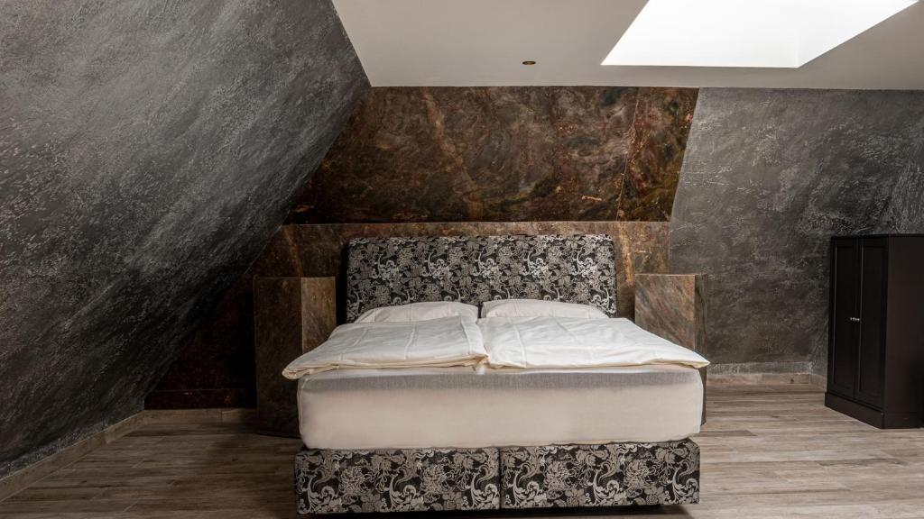 Postel nebo postele na pokoji v ubytování Buddha Hotel