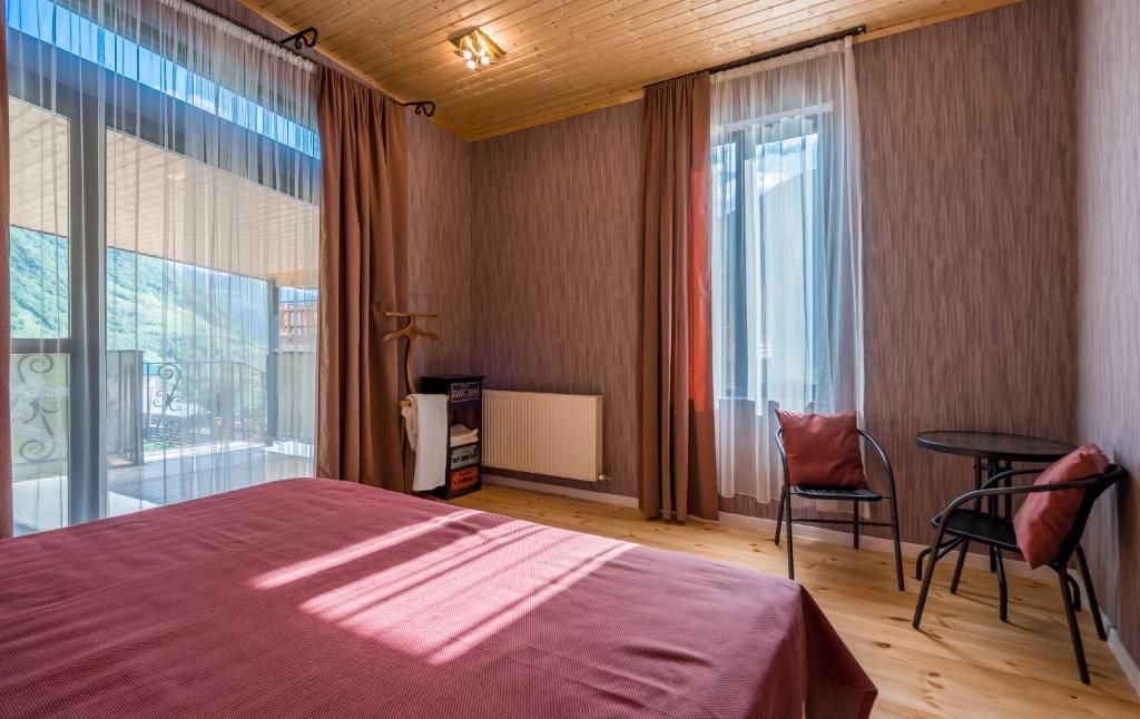Llit o llits en una habitació de Vache Hotel