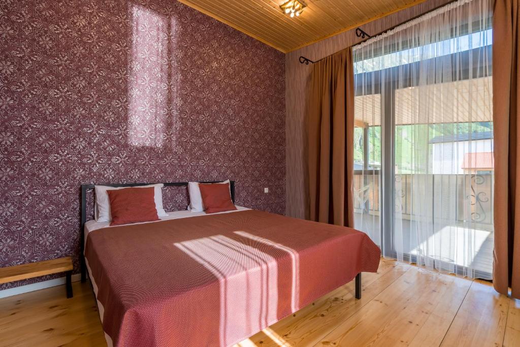 Llit o llits en una habitació de Vache Hotel
