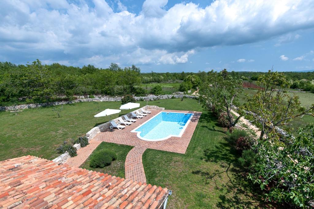 an aerial view of a yard with a swimming pool at Villa Bendek in Bokordići