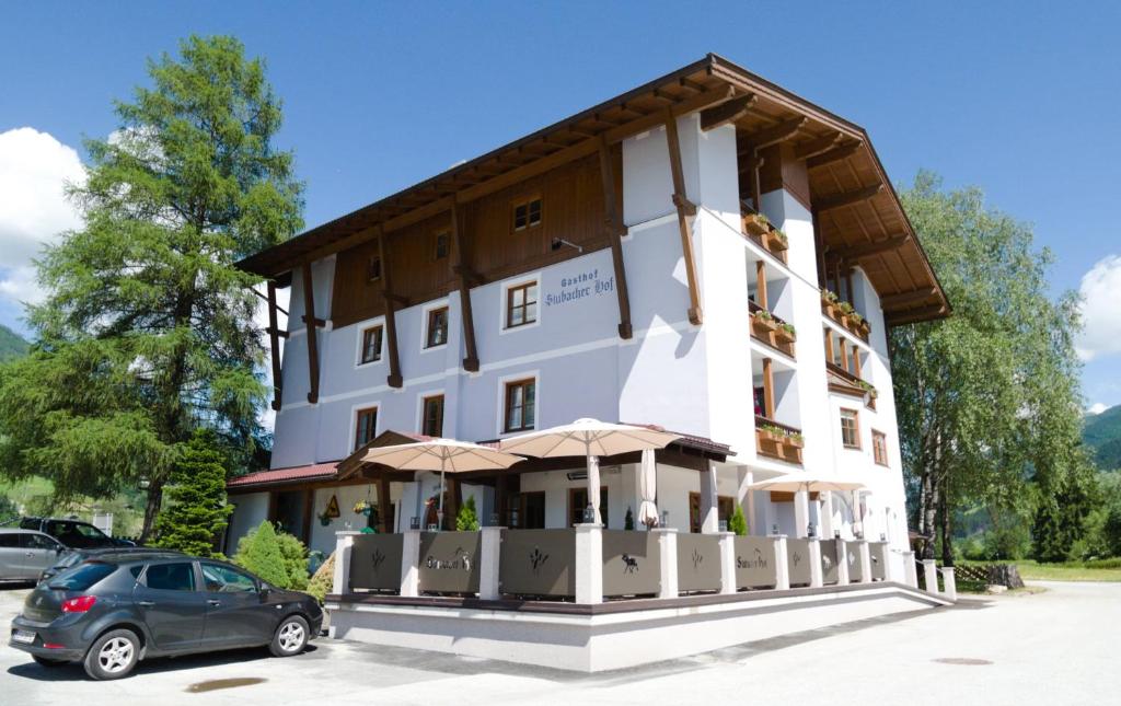 a building with a car parked in front of it at Stubacher Hof in Uttendorf