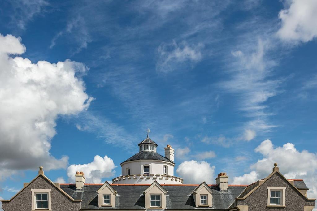 a white lighthouse on top of a building at Twr y Felin Hotel in St. Davids