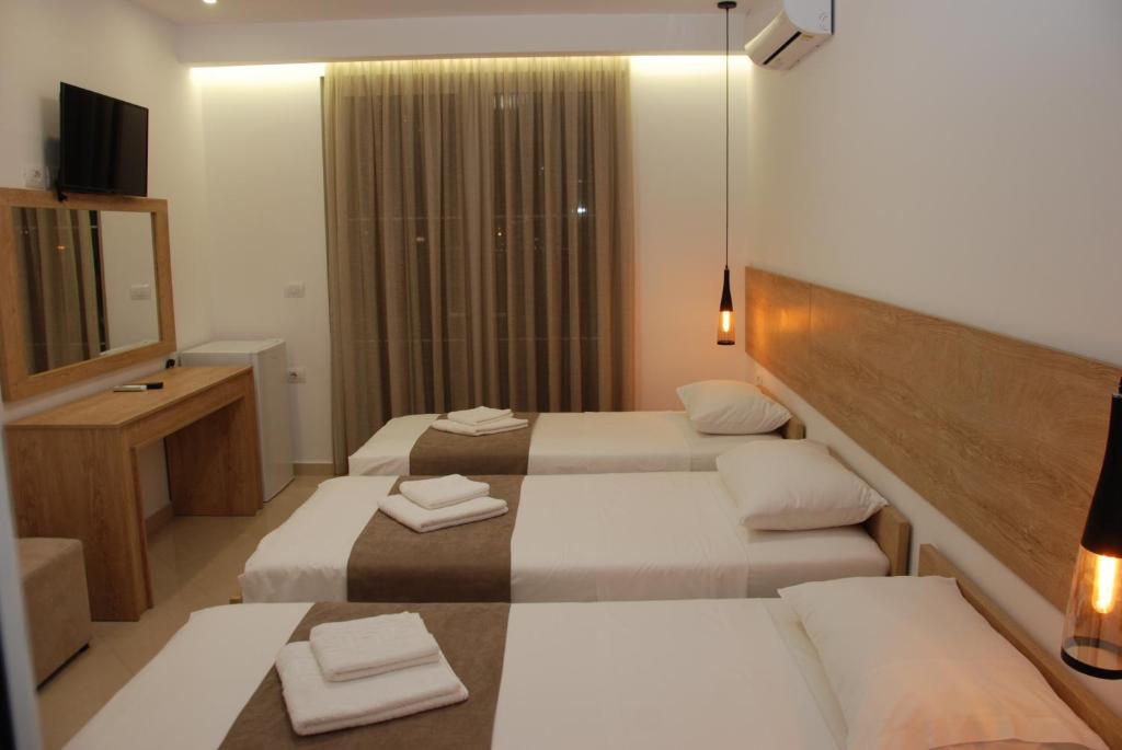 Postel nebo postele na pokoji v ubytování Hotel Mano