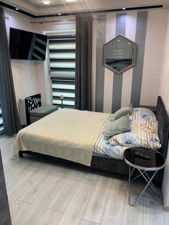 Posteľ alebo postele v izbe v ubytovaní Markiz Apartments