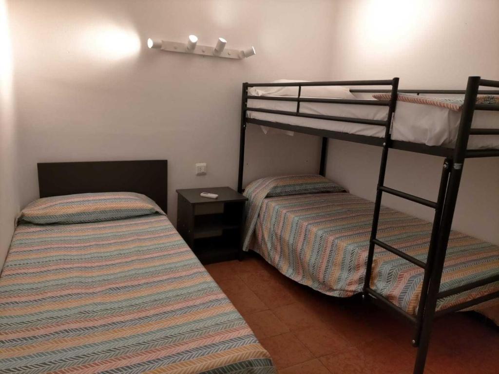 Postel nebo postele na pokoji v ubytování Fonda Can Dalfo by Vivere Stays