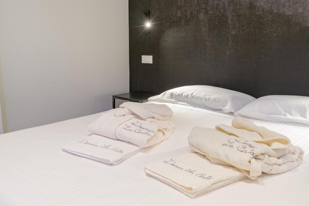 Letto o letti in una camera di Domus la Scala