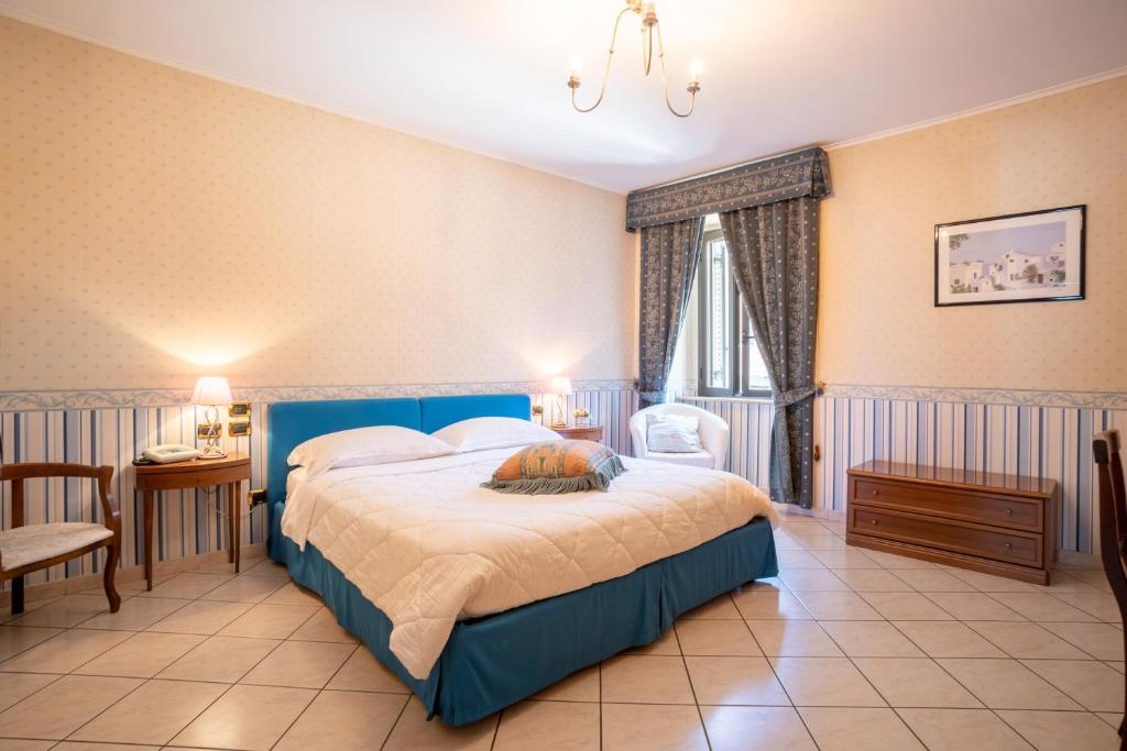 Postel nebo postele na pokoji v ubytování Locanda Da Otello