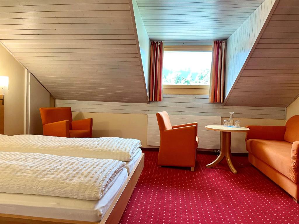 Postel nebo postele na pokoji v ubytování Boutique und Bier Hotel des alpes