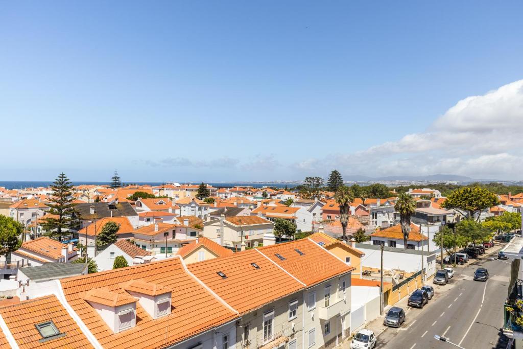 an aerial view of a town with orange roofs at Hotel Residencial Colibri in Costa da Caparica