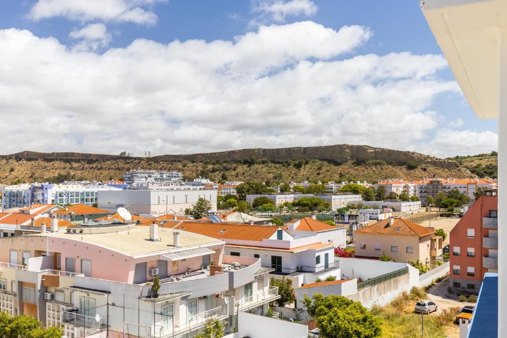a view of a city with buildings at Hotel Residencial Colibri in Costa da Caparica