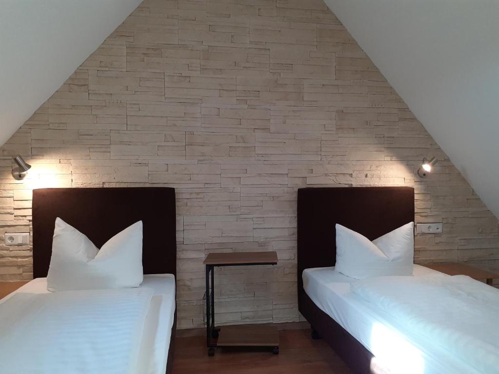 Postel nebo postele na pokoji v ubytování Hotel am Schloss