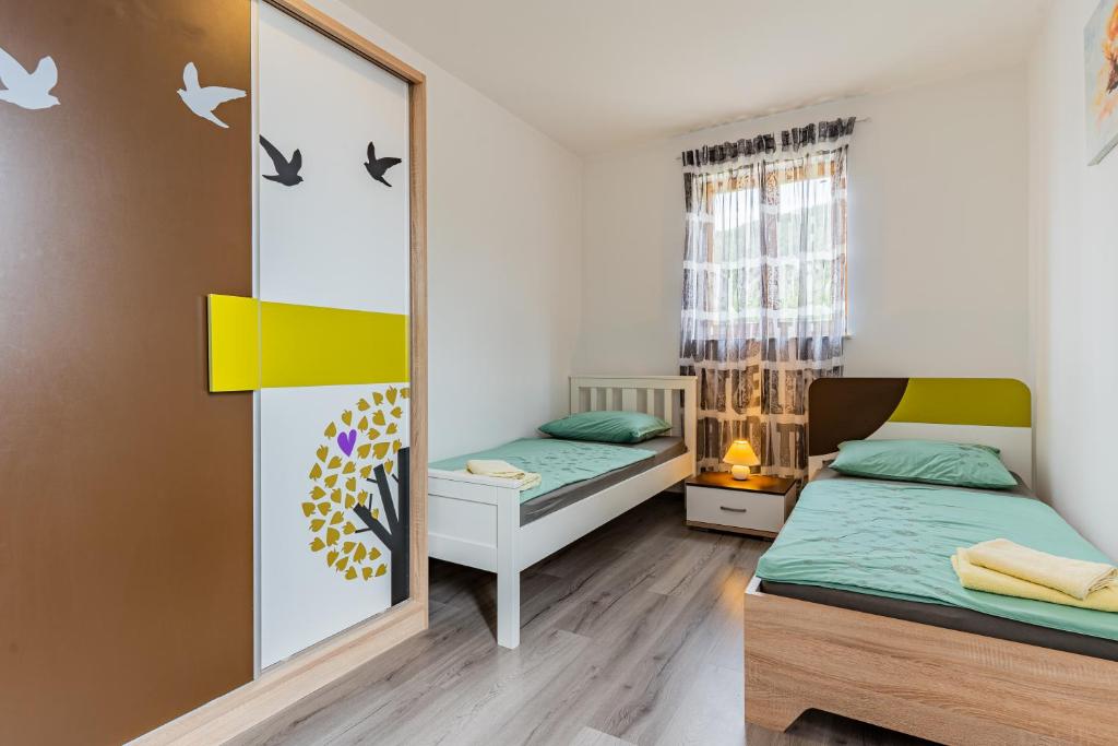 Postel nebo postele na pokoji v ubytování Apartment Livia