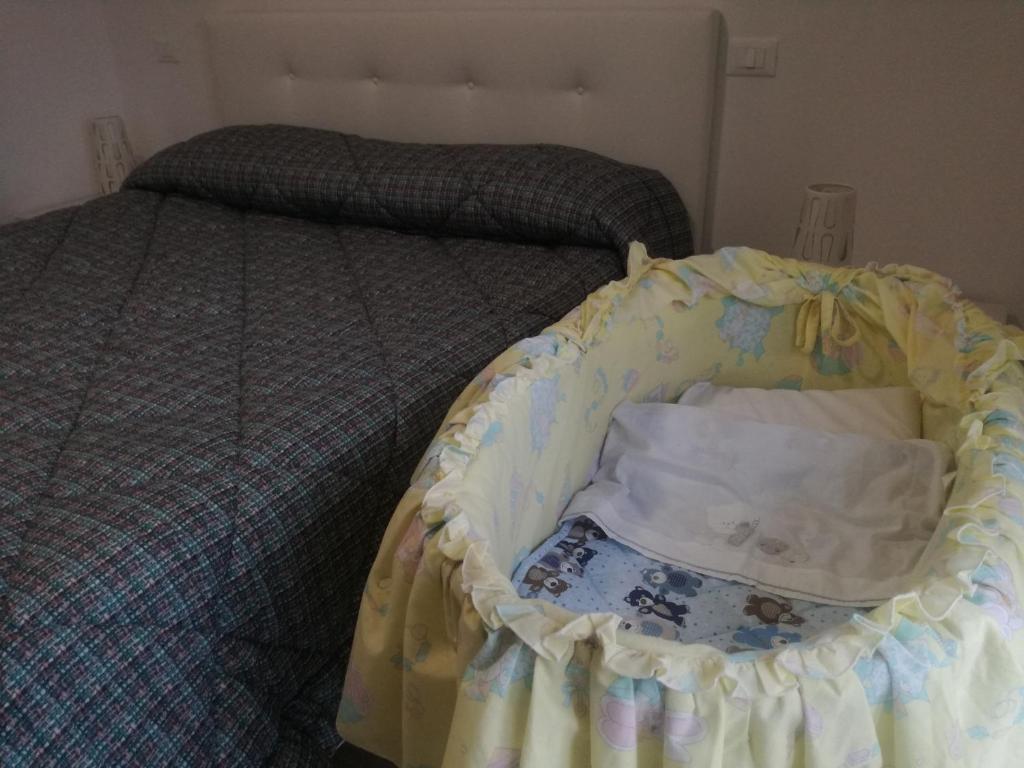 Postel nebo postele na pokoji v ubytování Da Clara e Raffaele