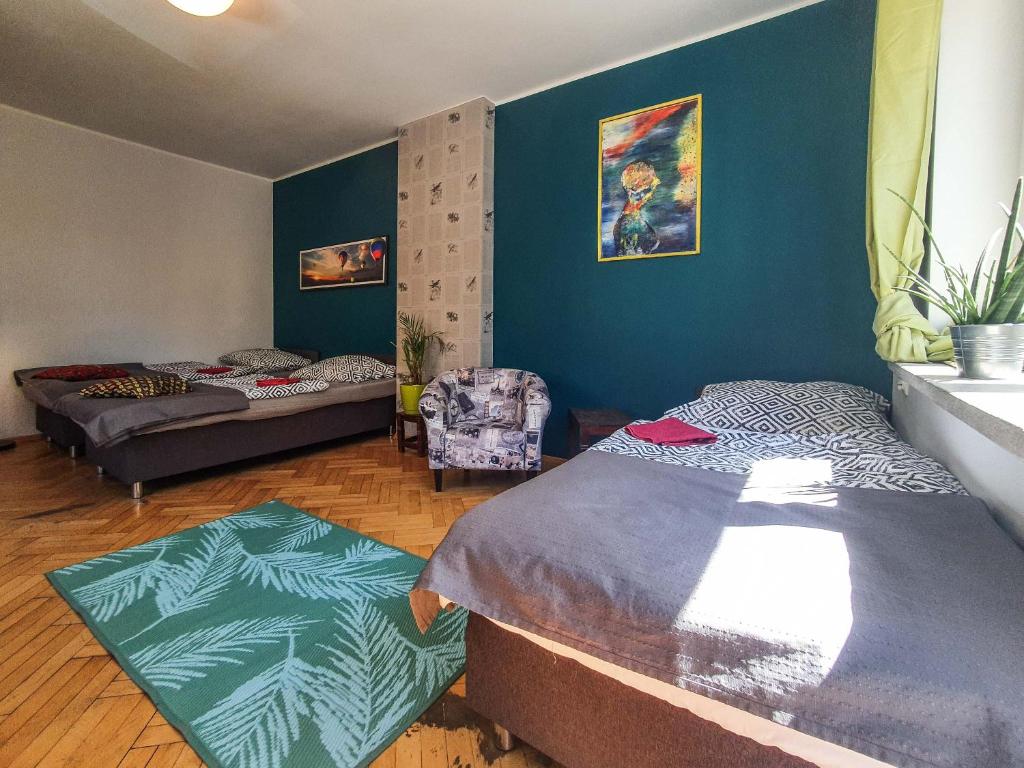 Posteľ alebo postele v izbe v ubytovaní Hostel Mazurska 8a