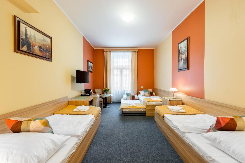 TV a/nebo společenská místnost v ubytování Hotel Libero