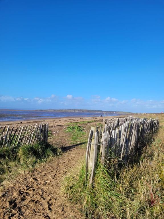 an old wooden fence on the beach at South Sands Hotel in Weston-super-Mare