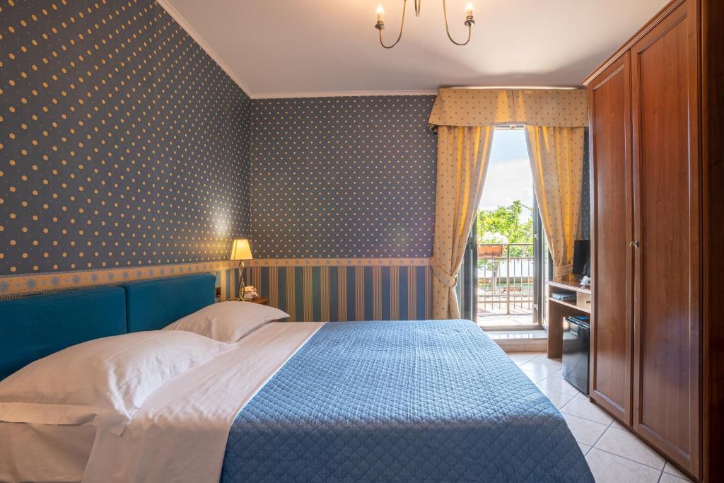 Postel nebo postele na pokoji v ubytování Locanda Da Otello