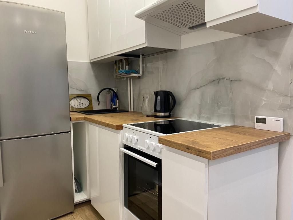 Kuchyňa alebo kuchynka v ubytovaní Apartament - U Wujka