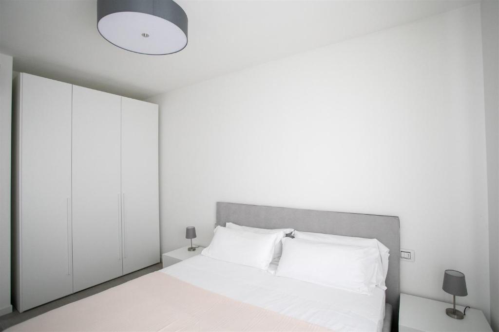 Postel nebo postele na pokoji v ubytování IseoLakeRental - Trivia Resort