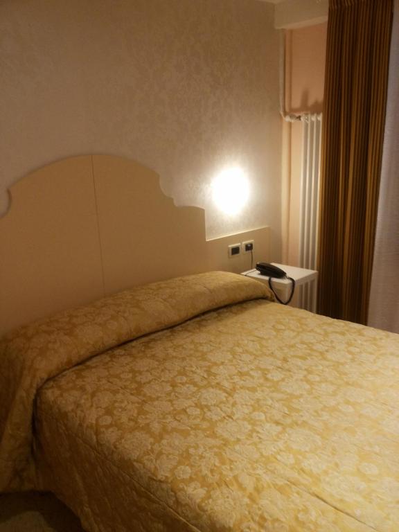 Postel nebo postele na pokoji v ubytování Hotel Adriatico