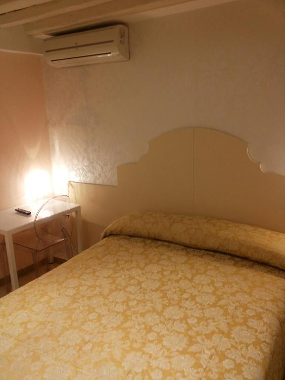 Postel nebo postele na pokoji v ubytování Hotel Adriatico