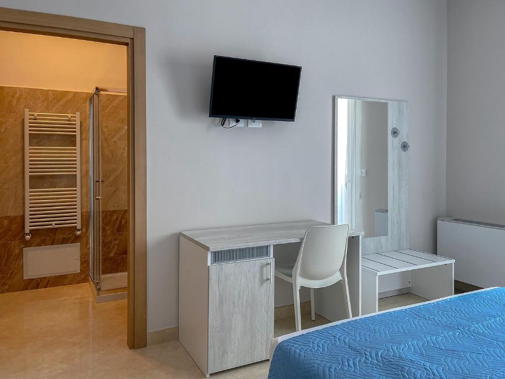 TV a/nebo společenská místnost v ubytování Karpignàna Hotel