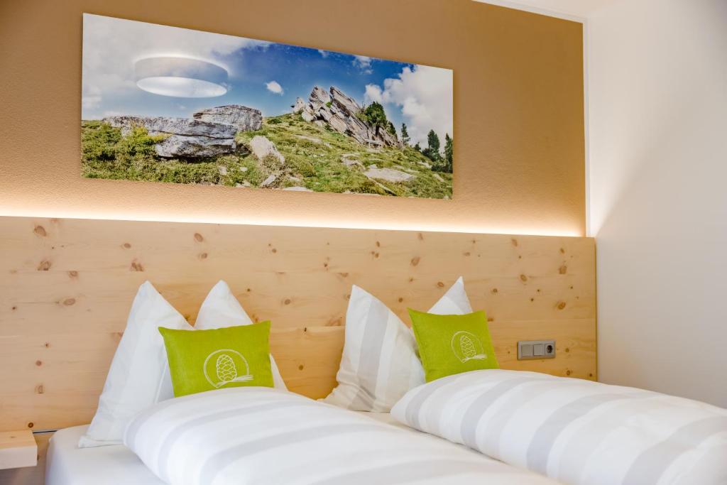 Postel nebo postele na pokoji v ubytování Gästehaus Fiedlwirt